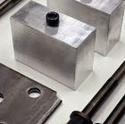 Aluminum trailer blocks and steel mounting hardware
