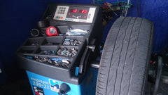 Tire mounted on a wheel-balancing machine